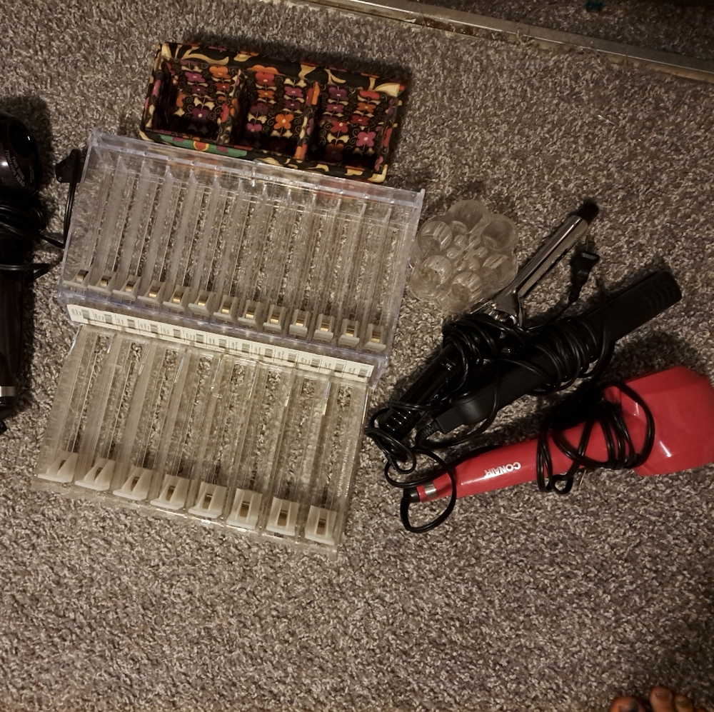 5 different Hair irons and makeup organizers/shelves